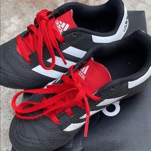 Little boy Adidas soccer gear. Cleats and shin guards. Size 11